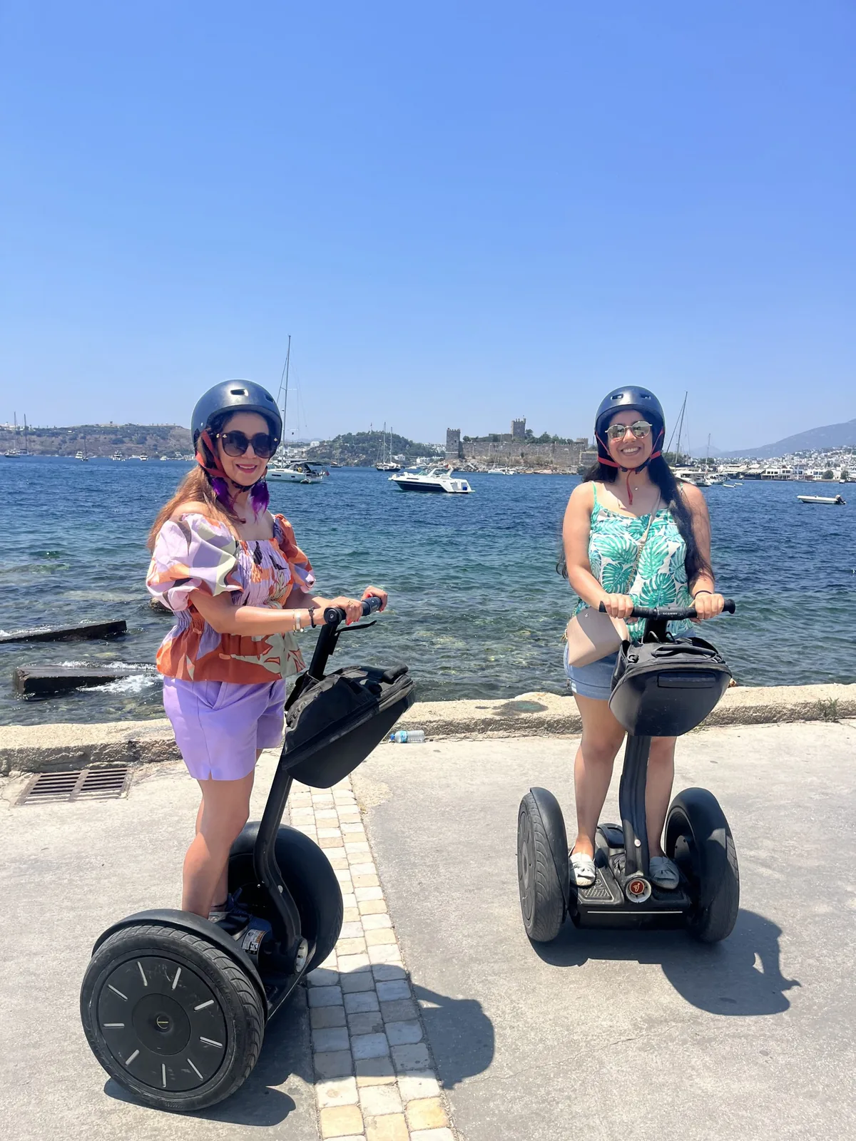 Helmeted Segway ride in a narrow street