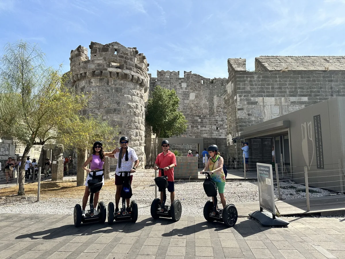 Happy Segway tour guests in Bodrum with coastal views